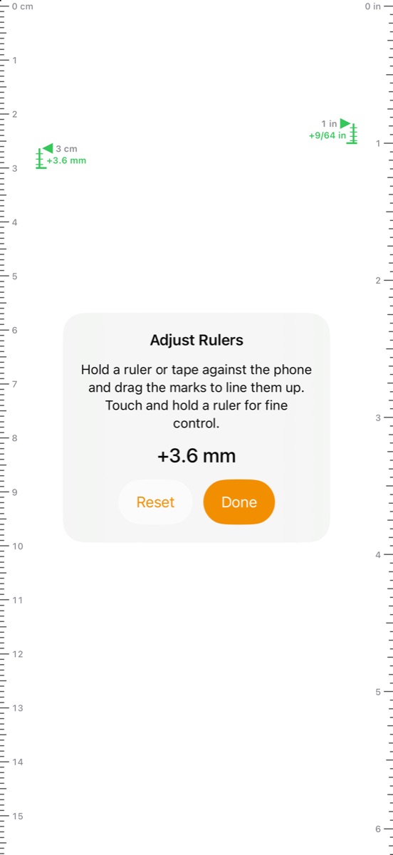 Adjust Rulers. Green markers at 3 cm on the left and 1 inch on the right show the marks moved plus 3.6 millimeters and plus 9/64 inch. A panel in the middle reads: Hold a ruler or tape against the phone and drag the marks to line them up. Touch and hold a ruler for fine control. Below it: plus 3.6 mm, Reset and Done.