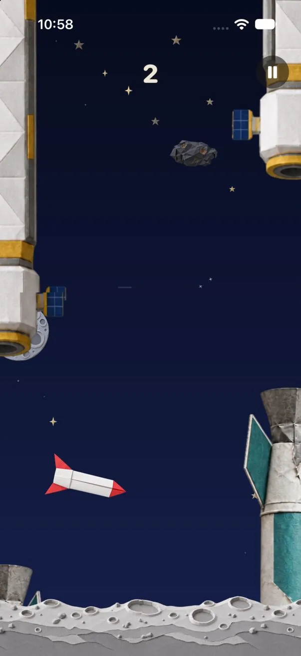 Outer Space: a red and white origami rocket flies between paper space station columns over a gray moon surface, with stars behind.